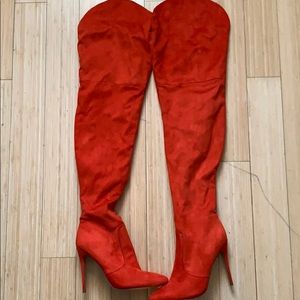 Thigh high orange boots